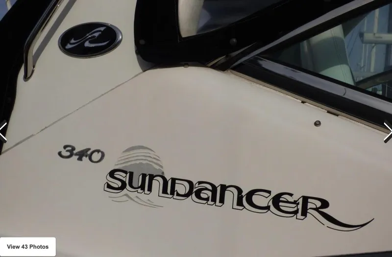 Slide: The Image of 2007 Sea Ray 340 Sundancer boat exterior with logo and model name. - 11