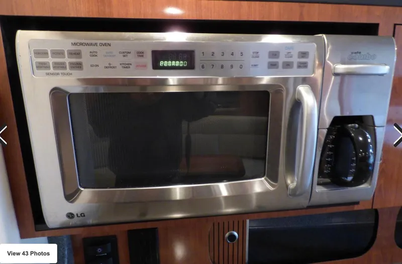 Slide: The Image of LG microwave oven and coffee maker combo in a 2007 Sea Ray 340 yacht kitchen. - 4