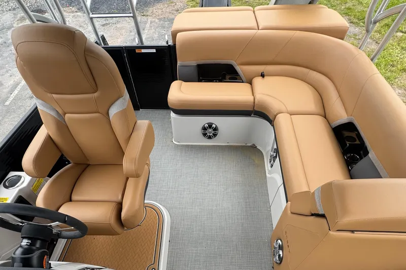 Slide: The Image of Luxurious interior of 2025 Crest Caribbean LX 250 boat with tan seating and modern design. - 5