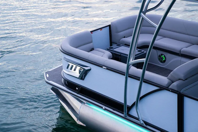 Slide: The Image of Manufacturer Provided Image: 2024 Crest Caribbean LX 250 pontoon boat on water, featuring luxurious seating. - 9