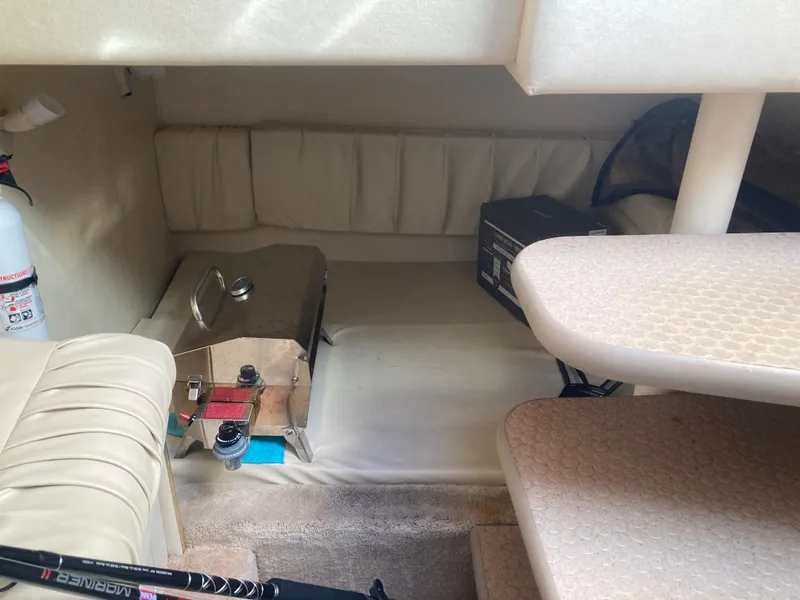 Slide: The Image of Interior cabin of 2000 Sea Ray 290 Amberjack with seating and storage. - 4