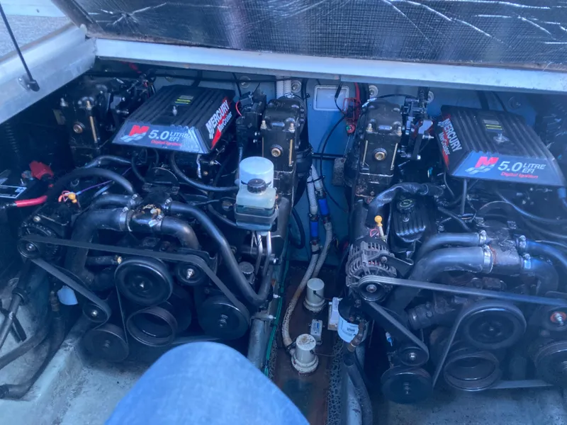 Slide: The Image of Twin Mercury 5.0L EFI engines in a 2000 Sea Ray 290 Amberjack boat. - 5