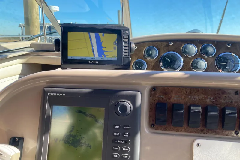 Slide: The Image of Dashboard of a 2000 Sea Ray 290 Amberjack with Garmin and Furuno navigation systems. - 8
