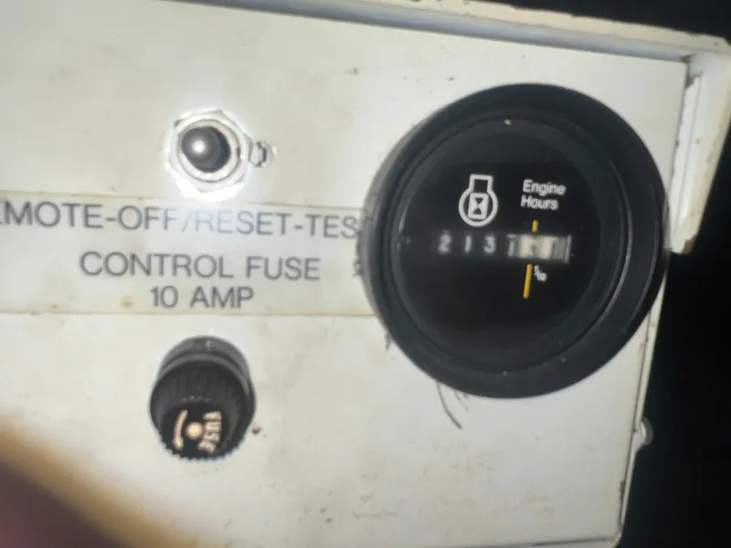 Slide: The Image of Control panel of 1987 Carver 420 Cockpit Motor Yacht showing engine hours and fuse details. - 35