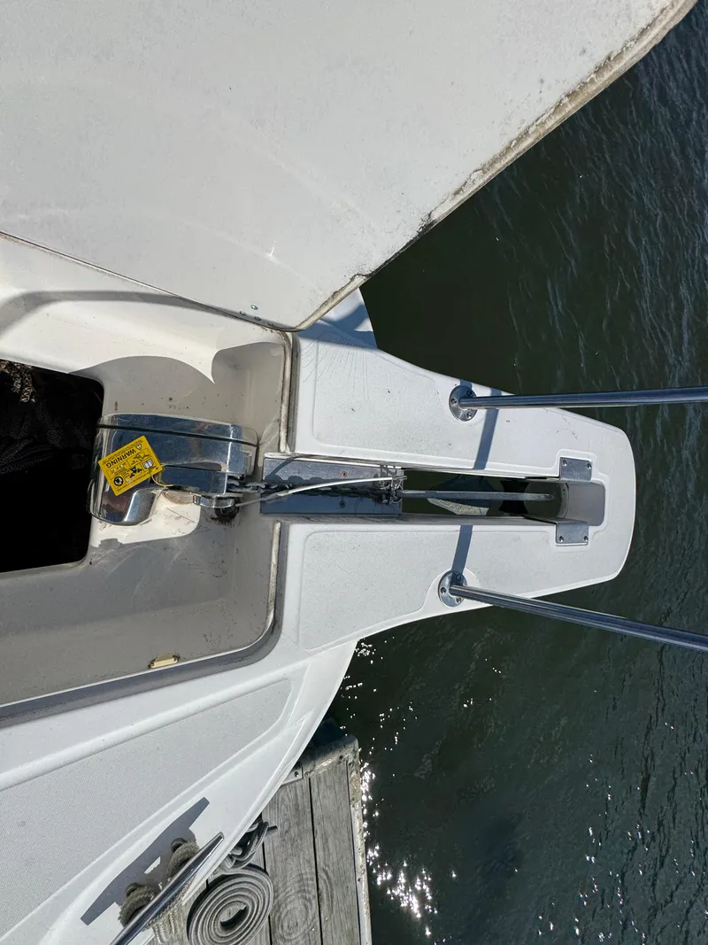 Slide: The Image of Bow of a 1999 Boston Whaler 28 Conquest boat with anchor and water view. - 20