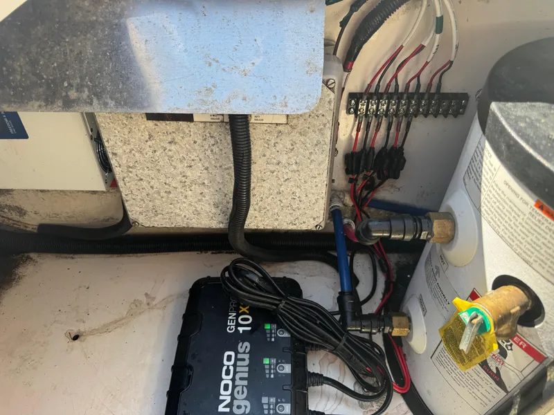 Slide: The Image of Electrical and plumbing components inside a 1999 Boston Whaler 28 Conquest boat. - 39