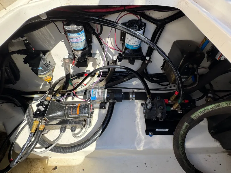 Slide: The Image of Engine compartment of a 1999 Boston Whaler 28 Conquest with visible wiring and components. - 41
