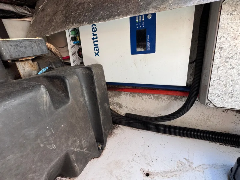 Slide: The Image of Electrical system inside a 1999 Boston Whaler 28 Conquest boat, featuring a Xantrex inverter. - 42