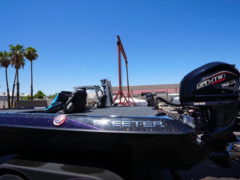 Slide: The Image of 2025 Skeeter ZXR20 boat with Yamaha SHO VMAX engine under clear blue sky. - 10