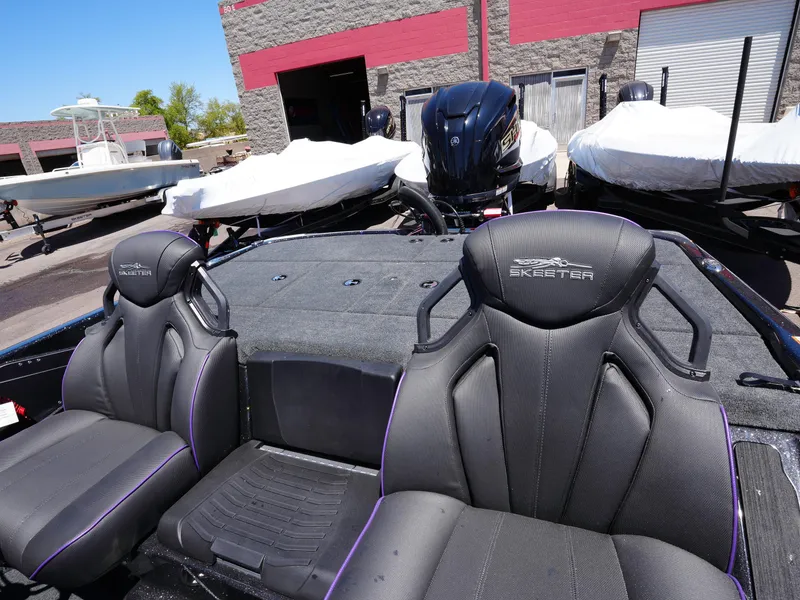 Slide: The Image of 2025 Skeeter ZXR20 boat interior with sleek black seats and modern design. - 12