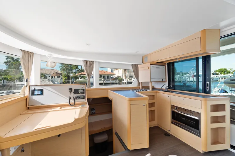 Slide: The Image of Inflatable boat with Suzuki outboard motor, docked near Lagoon 42 Owners Version, 2017 model. - 19