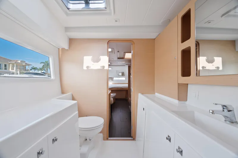 Slide: The Image of Luxurious interior of 2017 Lagoon 42 yacht with cozy seating and modern shelving. - 30