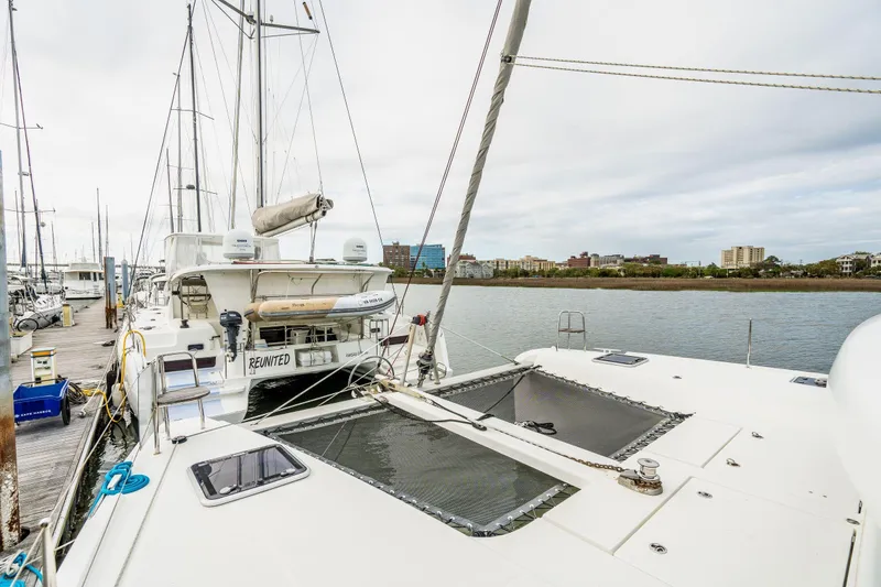 Slide: The Image of Open hatch on 2017 Lagoon 42 catamaran with blue cushion inside. - 76