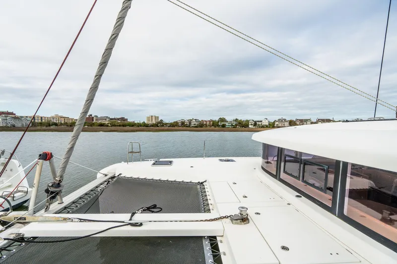 Slide: The Image of Open storage compartment on 2017 Lagoon 42 catamaran with equipment and blue rope. - 77