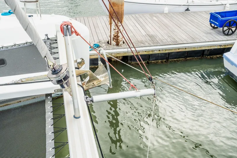 Slide: The Image of Mast and rigging of a 2017 Lagoon 42 sailboat against a cloudy sky. - 81