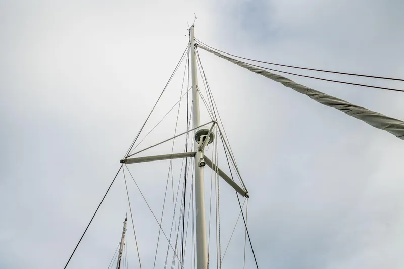 Slide: The Image of 2017 Lagoon 42 catamaran deck with rigging, docked near waterfront buildings. - 82