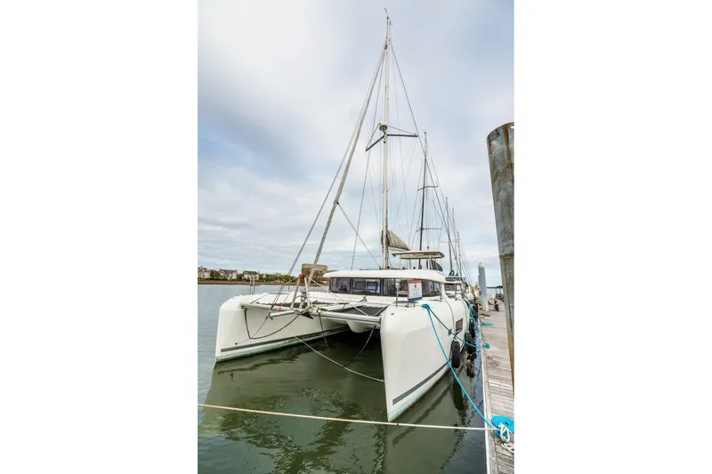 Slide: The Image of Aerial view of 2017 Lagoon 42 catamaran docked alongside other boats. - 90