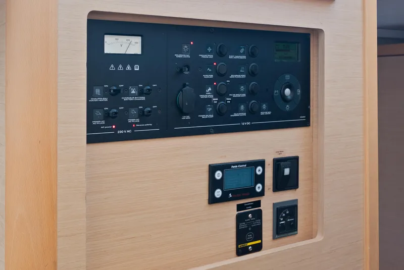 Slide: The Image of Spacious deck of 2017 Lagoon 42 catamaran with seating and table, docked at marina. - 23