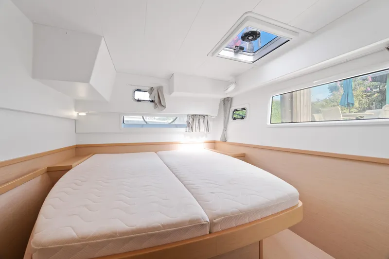 Slide: The Image of Washing machine inside 2017 Lagoon 42 catamaran, wooden interior, open cabinet door. - 32