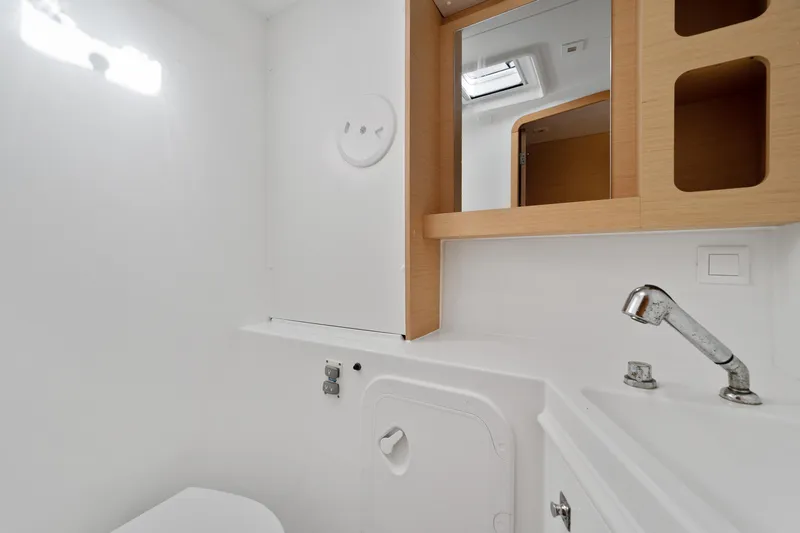 Slide: The Image of Interior of 2017 Lagoon 42 catamaran bathroom with modern fixtures and natural light. - 36