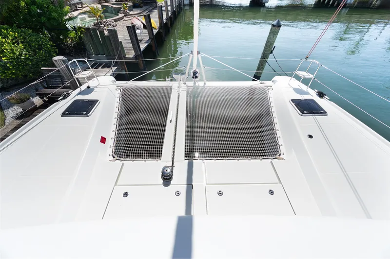 Slide: The Image of Deck view of a 2017 Lagoon 42 catamaran, featuring winches and ropes. - 52