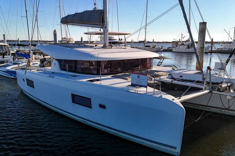 Slide: The Image of 2017 Lagoon 42 Owners Version catamaran docked at marina, available for sale. - 75