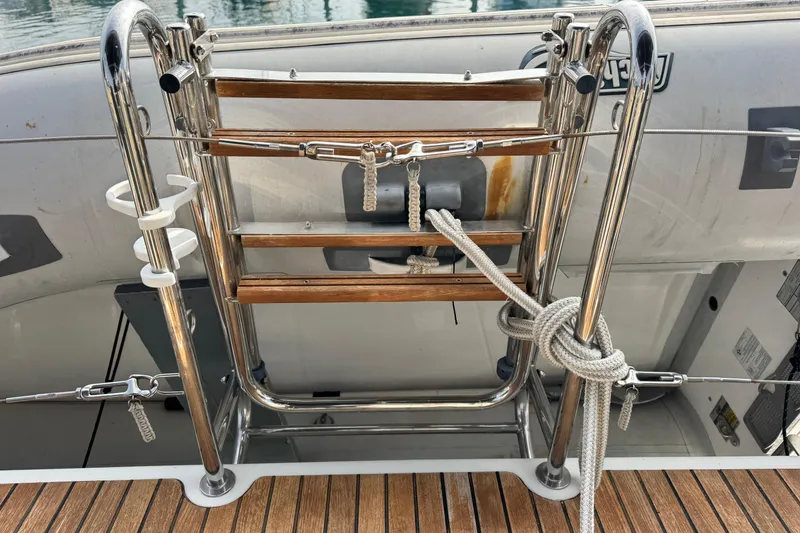 Slide: The Image of Stainless steel and wood ladder on 2016 Beneteau Oceanis 48 yacht deck. - 11