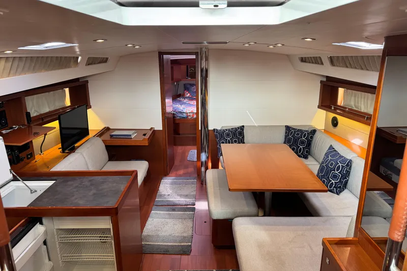 Slide: The Image of Luxurious interior of 2016 Beneteau Oceanis 48 yacht with dining area and modern amenities. - 13