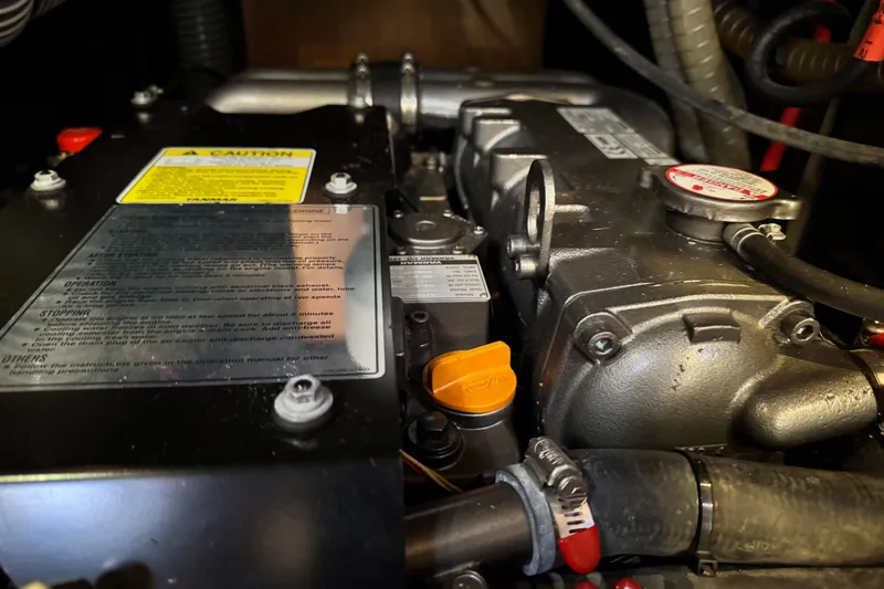 Slide: The Image of Engine compartment of a 2016 Beneteau Oceanis 48 sailboat, showing detailed components. - 31