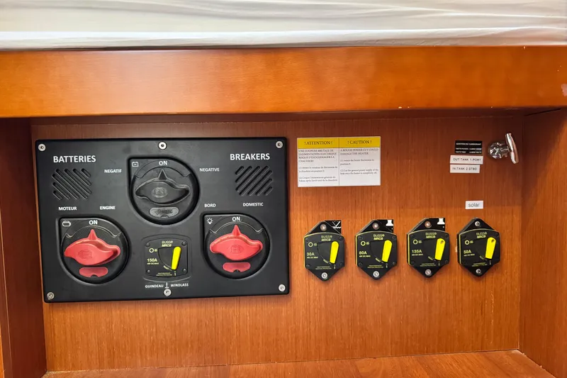 Slide: The Image of Electrical panel of a 2016 Beneteau Oceanis 48 sailboat with battery and breaker switches. - 33