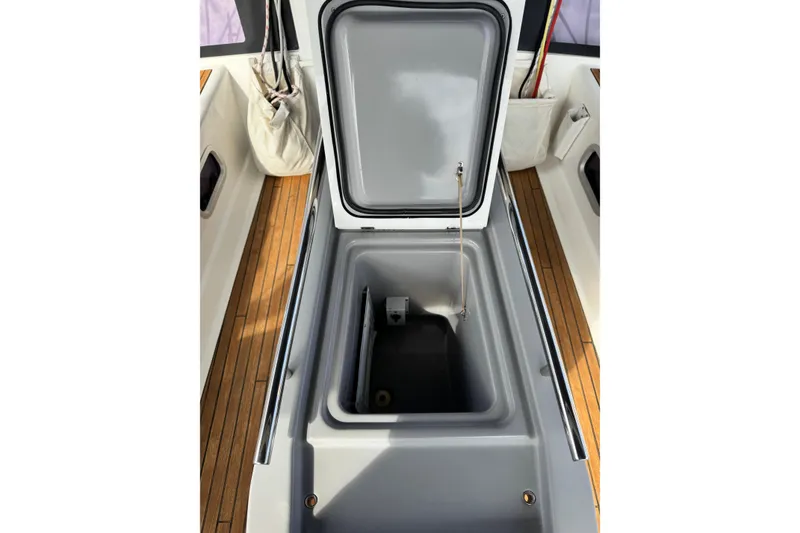Slide: The Image of Open storage compartment on 2016 Beneteau Oceanis 48 sailboat deck. - 34
