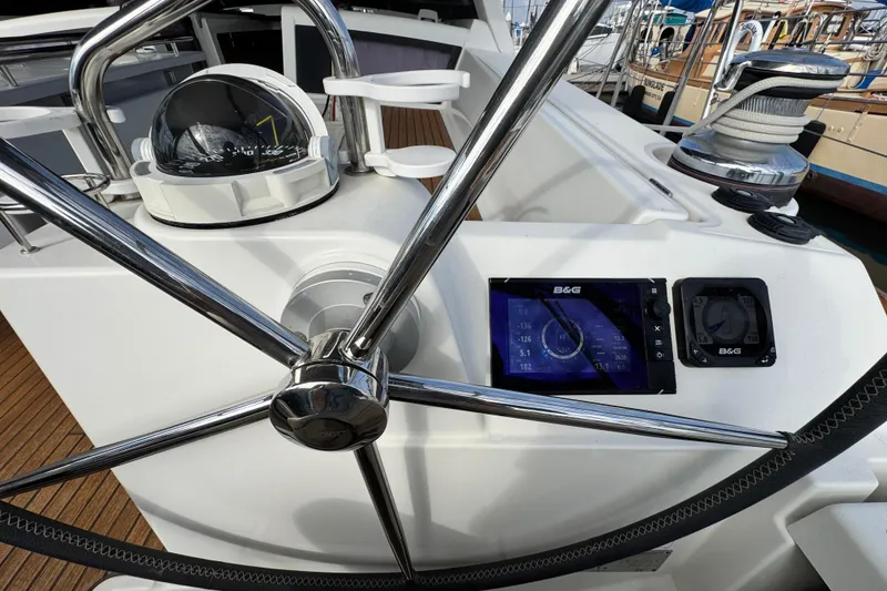 Slide: The Image of Steering wheel and navigation instruments on 2016 Beneteau Oceanis 48 yacht. - 36