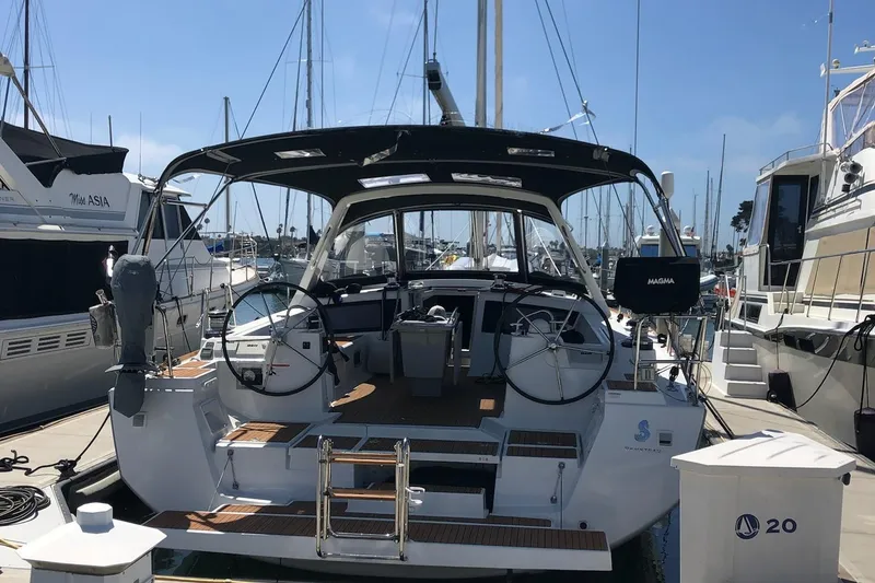 Slide: The Image of 2016 Beneteau Oceanis 473 yacht docked at marina, rear view. - 44