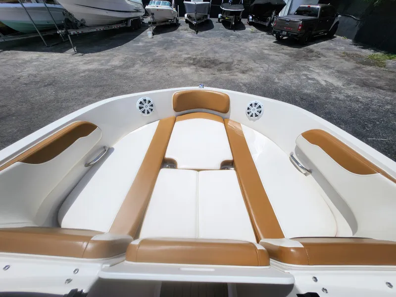 Slide: The Image of 2021 Bayliner VR6 Bowrider OB interior with tan and white seating. - 15