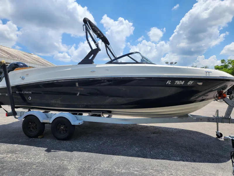 Slide: The Image of 2021 Bayliner VR6 Bowrider OB on trailer under a blue sky. - 19