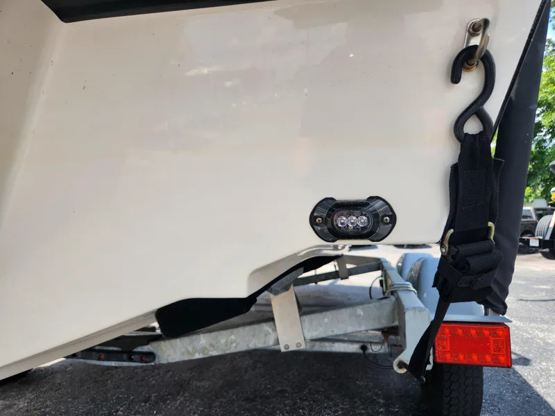 Slide: The Image of 2021 Bayliner VR6 Bowrider OB trailer hitch and light detail. - 4