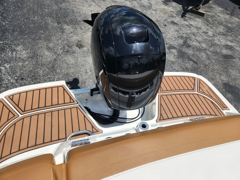 Slide: The Image of 2021 Bayliner VR6 Bowrider OB with sleek outboard motor and stylish deck design. - 6
