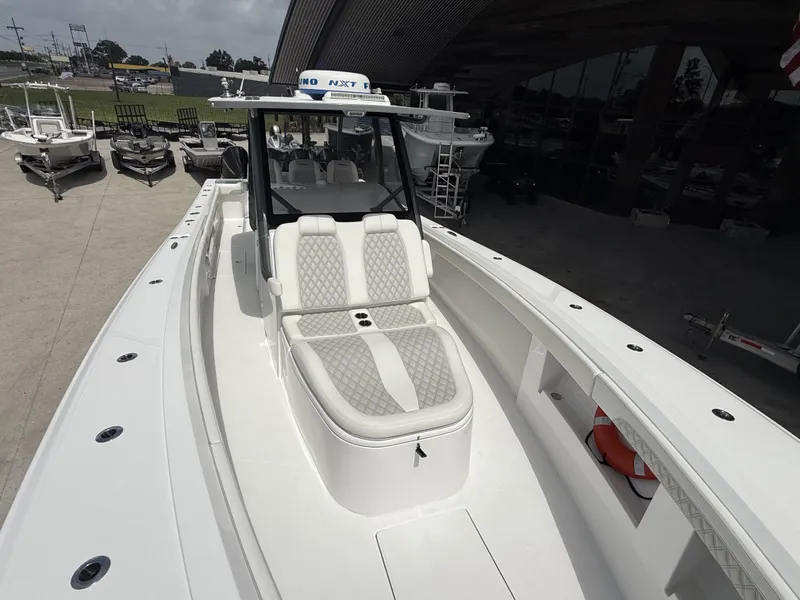 Slide: The Image of 2024 Front Runner 39 CC boat with sleek white design and spacious seating. - 19