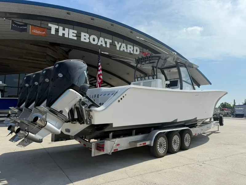 Slide: The Image of 2024 Front Runner 39 CC boat on trailer at The Boat Yard dealership. - 2