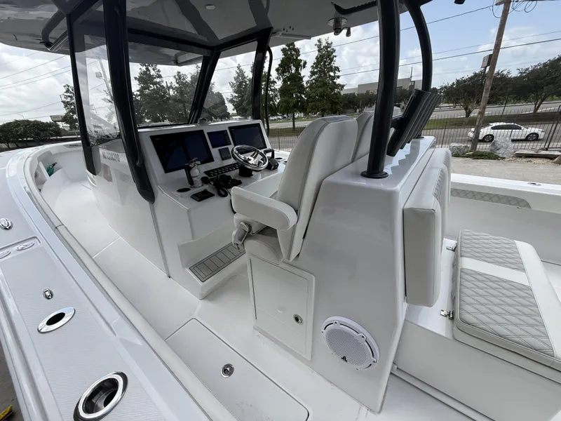 Slide: The Image of 2024 Front Runner 39 CC boat interior with modern helm and seating. - 25