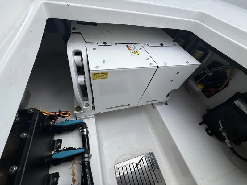 Slide: The Image of 2024 Front Runner 39 CC boat engine compartment with electrical components and wiring. - 27