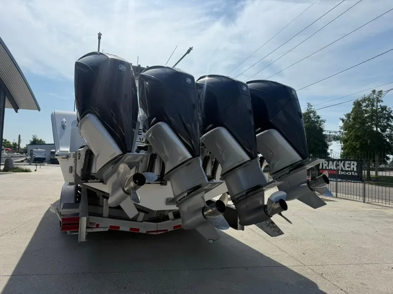 Slide: The Image of 2024 Front Runner 39 CC boat with four powerful outboard engines. - 3