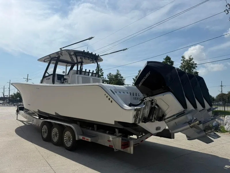 Slide: The Image of 2024 Front Runner 39 CC boat on trailer with multiple Mercury outboard engines. - 4