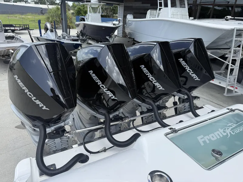 Slide: The Image of 2024 Front Runner 39 CC boat with four Mercury outboard engines. - 8
