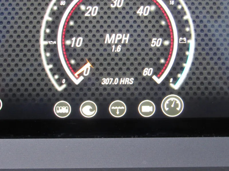 Slide: The Image of 2021 Malibu Wakesetter 23 LSV dashboard with advanced digital controls and steering wheel. - 13