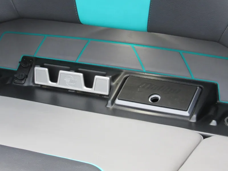 Slide: The Image of 2021 Malibu Wakesetter 23 LSV interior with teal and gray seating, modern dashboard. - 7
