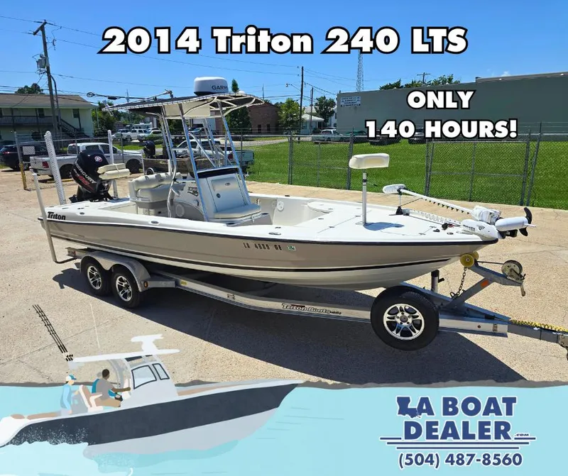 Slide: The Image of 2014 Triton 240 LTS Pro boat on trailer, only 140 hours, for sale at LA Boat Dealer. - 0