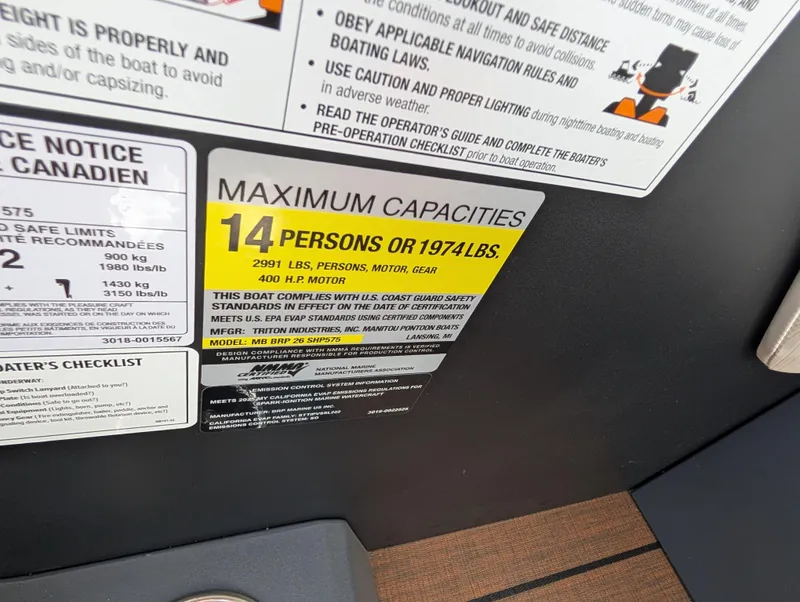 Slide: The Image of Manitou Explore 2025 boat capacity label, 14 persons or 1974 lbs, 400 HP motor. - 21