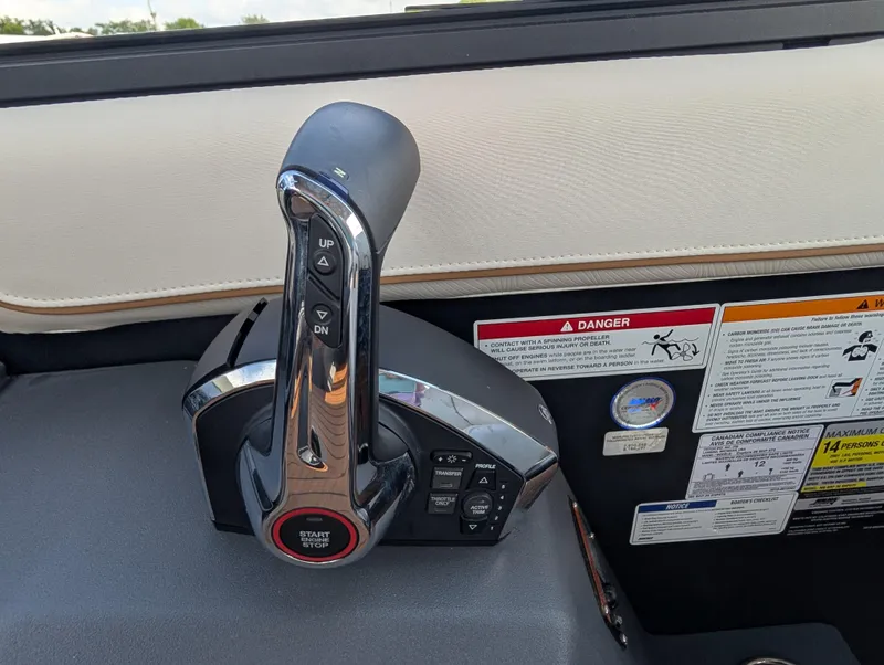 Slide: The Image of Throttle control panel of 2025 Manitou Explore boat with safety warnings. - 22