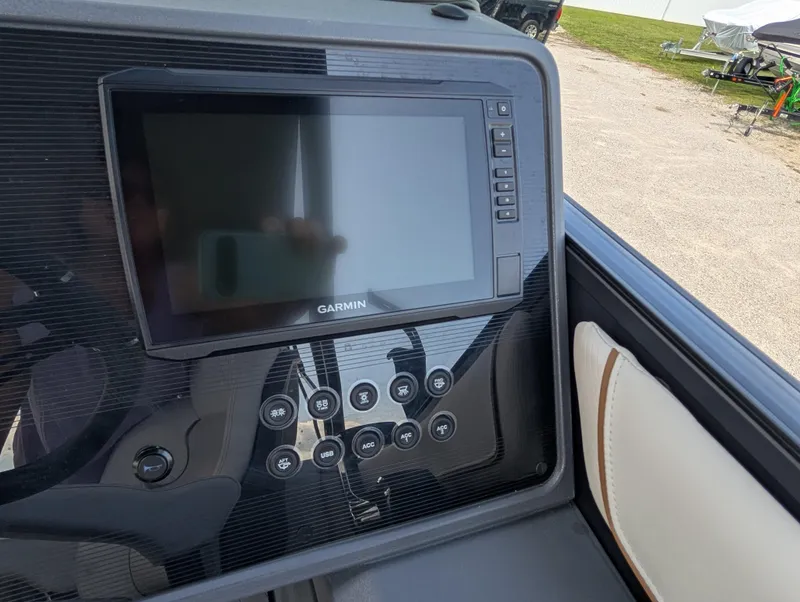 Slide: The Image of Control panel of 2025 Manitou Explore with Garmin display and various buttons. - 24